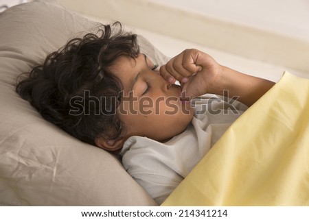 little boy sucking his thumb at night 商業照片 © 