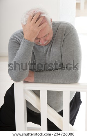 obese man looking worried with hand on forehead,looking depress