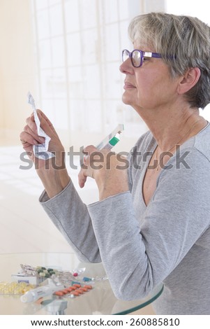 Senior Woman Taking Medication