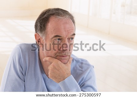 portrait of thoughtful middle aged man looking away