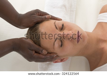 Relaxing therapy: Beautiful Woman Receiving Head massage