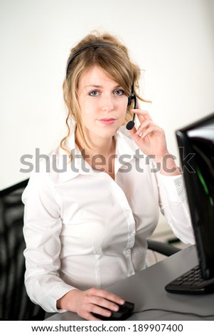 portrait of cheerful young woman telephone operator