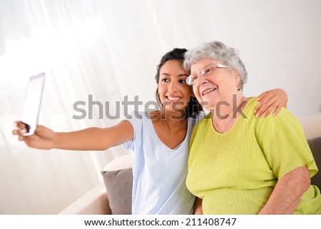two generation multi-ethnic womans making a funny selfie together