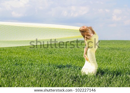 Smiling young woman wrapped in yellow cloth