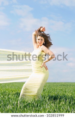 Young gorgeous woman wrapped in yellow cloth