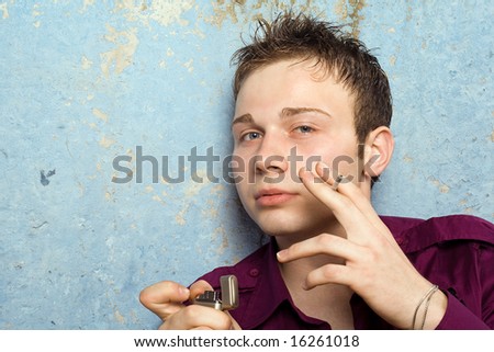 portrait of the young man with a cigarette and a lighter 2