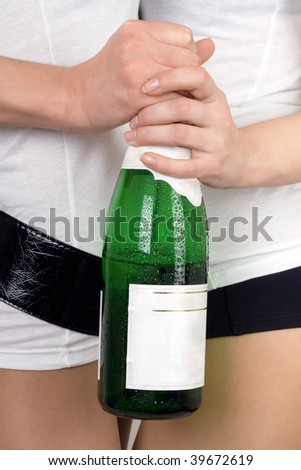 Two girls with a champagne bottle in a hands
