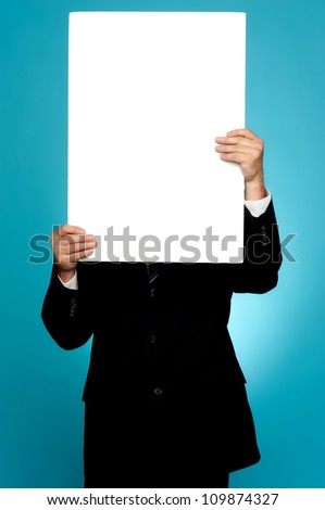 Manager hiding his face behind white banner ad isolated on gradient background