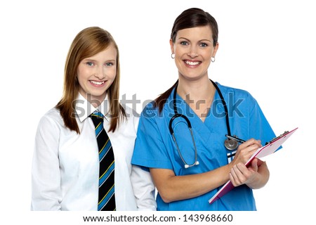 Smiling lady doctor with a schoolgirl