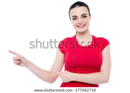 Cute caucasian woman pointing to her right