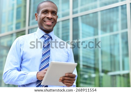 Male executive with digital tablet at outdoors