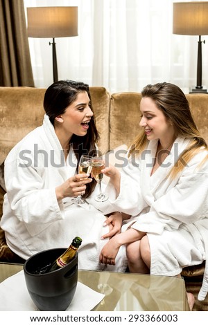 Relaxed young women enjoying wine