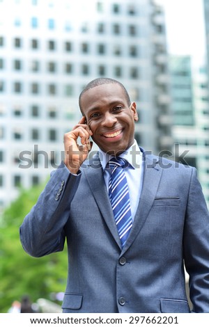 Businessman on call,  outside office building
