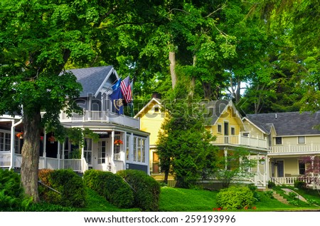 BAY VIEW, MI - JUNE 26, 2014: Quaint old homes, many of them providing tourist lodgings, line the shady streets of this one-time Methodist retreat center next to Petoskey on Lake Michigan.