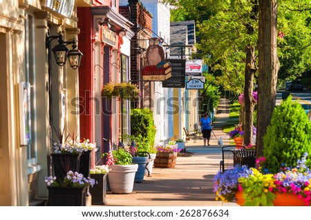 HUDSON, OH - JUNE 14, 2014: Quaint shops and businesses dating back more than a century line Hudson\'s Main Street looking north.