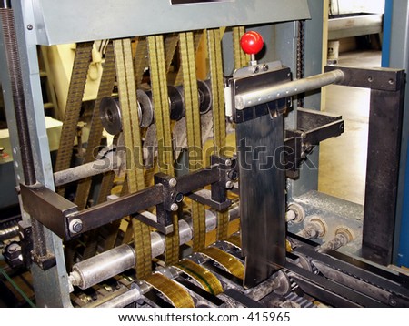 Belts on press sheet cutter in publishing house
