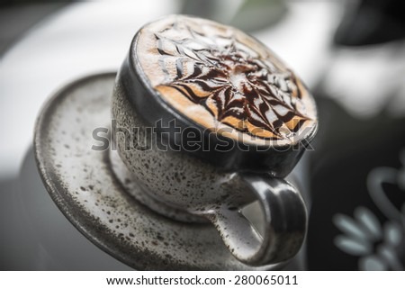 Cup of latte coffee, Cappuccino or latte coffee cup with art foam