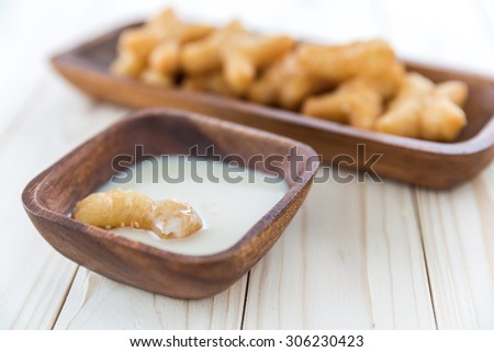 Deep-fried dough stick with sweetened condensed milk