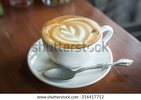 cup of cappuccino, cup of coffee, cup of coffee on brown wooden table