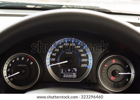 Car Dashboard. Close up image of illuminated car dashboard, lose up of car dashboard and Odometer