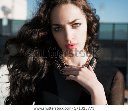 beautiful brunette female with wavy long shine hair.