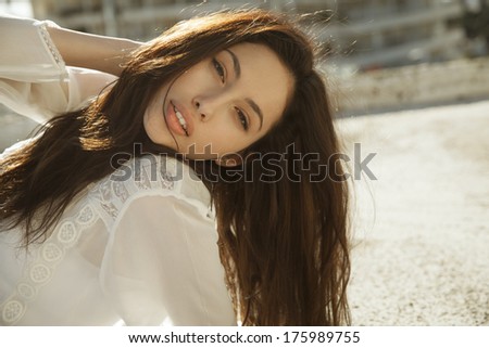 Gorgeous brunette female with long hair. classy beauty. horizontal shot