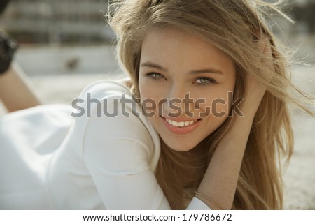 Wonderful woman with a lovely look and bright make up on a sunny day. horizontal shot. outdoors