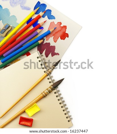Creative Art Background made of old paint brushes, albums, palette, colored pencils and other tools for drawing