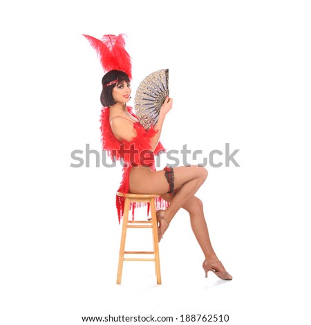 Burlesque dancer with red plumage and red short dress, isolated on white