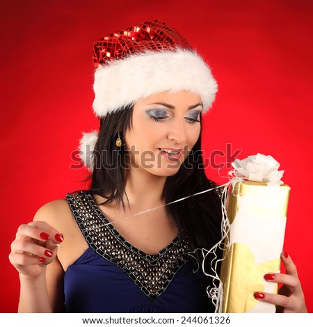 Beautiful and sexy woman wearing santa clause costume, studio