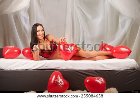 Valentines beauty girl with balloon in sleeping room, studio