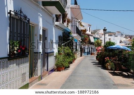 TORROX, SPAIN - JULY 1, 2008 - Row of typical Spanish houses with partly tiled walls, Torrox, Costa del Sol, Malaga Province, Andalucia, Spain, Western Europe, July 1, 2008.