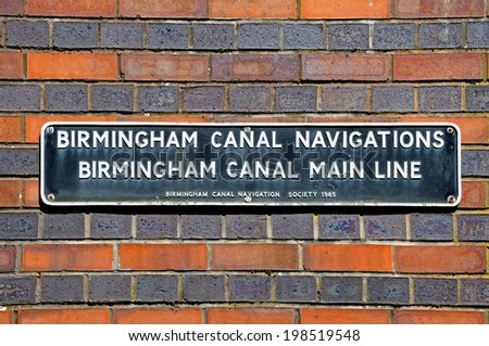 BIRMINGHAM, UK - MAY 14, 2014 - Birmingham Canal Main Line sign on a brick wall, Gas Street Canal Basin, Birmingham, West Midlands, England, UK, Western Europe, May 14, 2014.