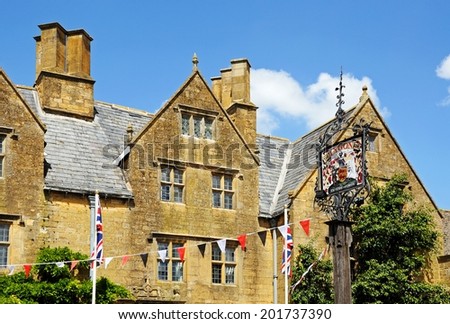 BROADWAY, UK - JUNE 12, 2014 - View of The Lygon Arms Hotel along High Street, Broadway, Cotswolds, Worcestershire, England, UK, Western Europe, June 12, 2014.
