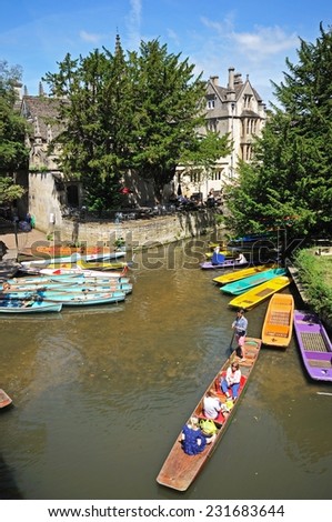 OXFORD, UK - JUNE 17, 2014 - Punts and rowing boats on river Cherwell with Magdalen college to the rear, Oxford, Oxfordshire, England, UK, Western Europe, June 17, 2014.
