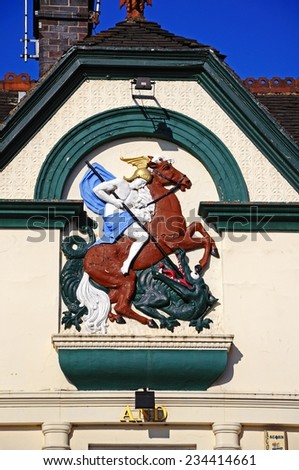 ASHBOURNE, UNITED KINGDOM - SEPTEMBER 7, 2014 - The George and Dragon pub emblem in the Market Place, Ashbourne, Derbyshire, England, UK, Western Europe, September 7, 2014.