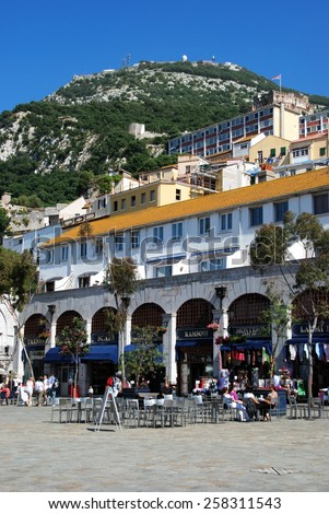 GIBRALTAR, UK - APRIL 20, 2009 - Tourists relaxing at pavement cafes in Grand Casemates Square, Gibraltar, United Kingdom, Western Europe, April 20, 2009.