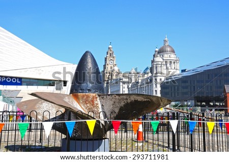 LIVERPOOL, UNITED KINGDOM - JUNE 11, 2015 - Ships propeller with the Three Graces to the rear, Liverpool, Merseyside, England, UK, Western Europe, June 11, 2015.