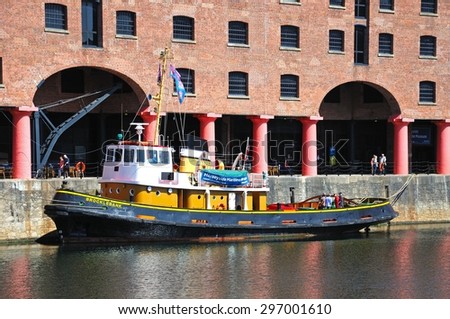 LIVERPOOL, UNITED KINGDOM - JUNE 11, 2015 - Tug boat moored in Albert Dock, Liverpool, Merseyside, England, UK, Western Europe, June 11, 2015.