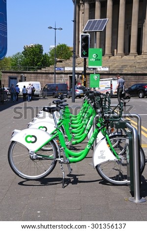 LIVERPOOL, UNITED KINGDOM - JUNE 11, 2015 - City hire bikes with St Georges Hall to the rear near Lime Street Station, Liverpool, Merseyside, England, UK, Western Europe, June 11, 2015.