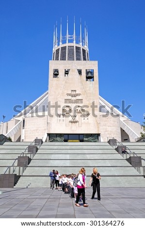 LIVERPOOL, UNITED KINGDOM - JUNE 11, 2015 - Teachers with a party of school children by the steps leading to the Roman Catholic Cathedral, Liverpool, Merseyside, England, UK, June 11, 2015.