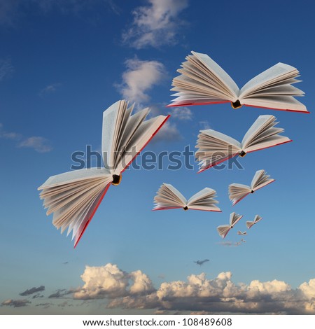 Books are flying against the background of the cloudy sky and  earth