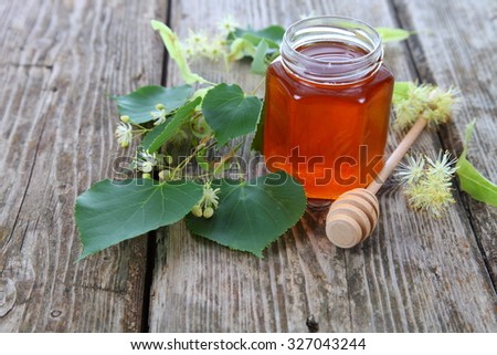 Linden honey on the old wooden table