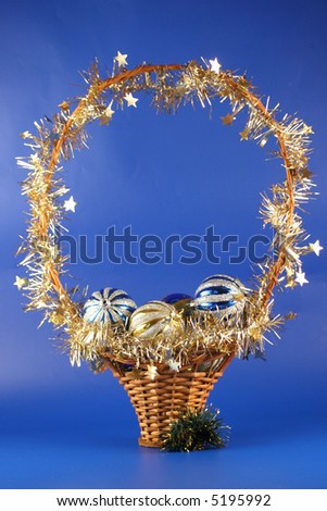 Christmas basket with balls on a dark blue background.