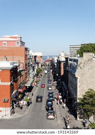 QUEBEC Ã¢Â?Â? SEPTEMBER 24: Shoppers and cars move up and down Rue Saint-Jean in Quebec City, Quebec on September 24, 2011. Quebec City is the capitol of the Canadian province of Quebec.