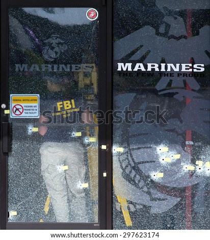 CHATTANOOGA, TN/USA - JULY 18: An FBI agent gathers evidence at the Armed Forces Career Center in Chattanooga, TN on July 18, 2015. An attack on the center was carried out on July 16th, 2015.