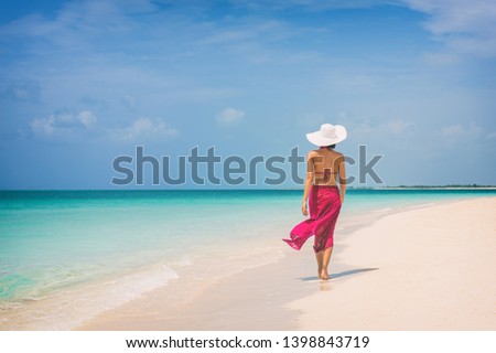 Similar – Image, Stock Photo Woman with pink pareo on sandy beach