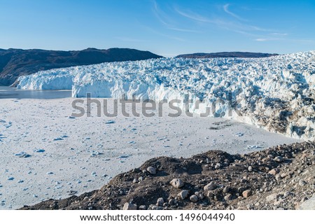 Greenland Glacier front of Eqi glacier in West Greenland AKA Ilulissat and Jakobshavn Glacier. Drains 6.5 percent of the Greenland ice sheet, Heavlly affected by Climate Change and Global Warming