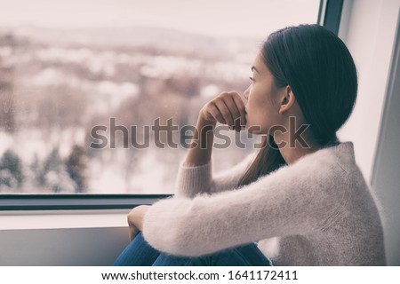 Similar – Image, Stock Photo Corona Thoughts | The evening sun illuminates a green area with trees and a parking lot in front of a row of houses in the background, which is closed off by a red and white fluttering band