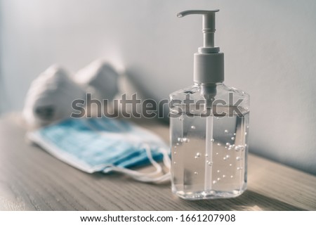 Coronavirus prevention medical surgical masks and hand sanitizer gel for hand hygiene corona virus protection. 商業照片 © 